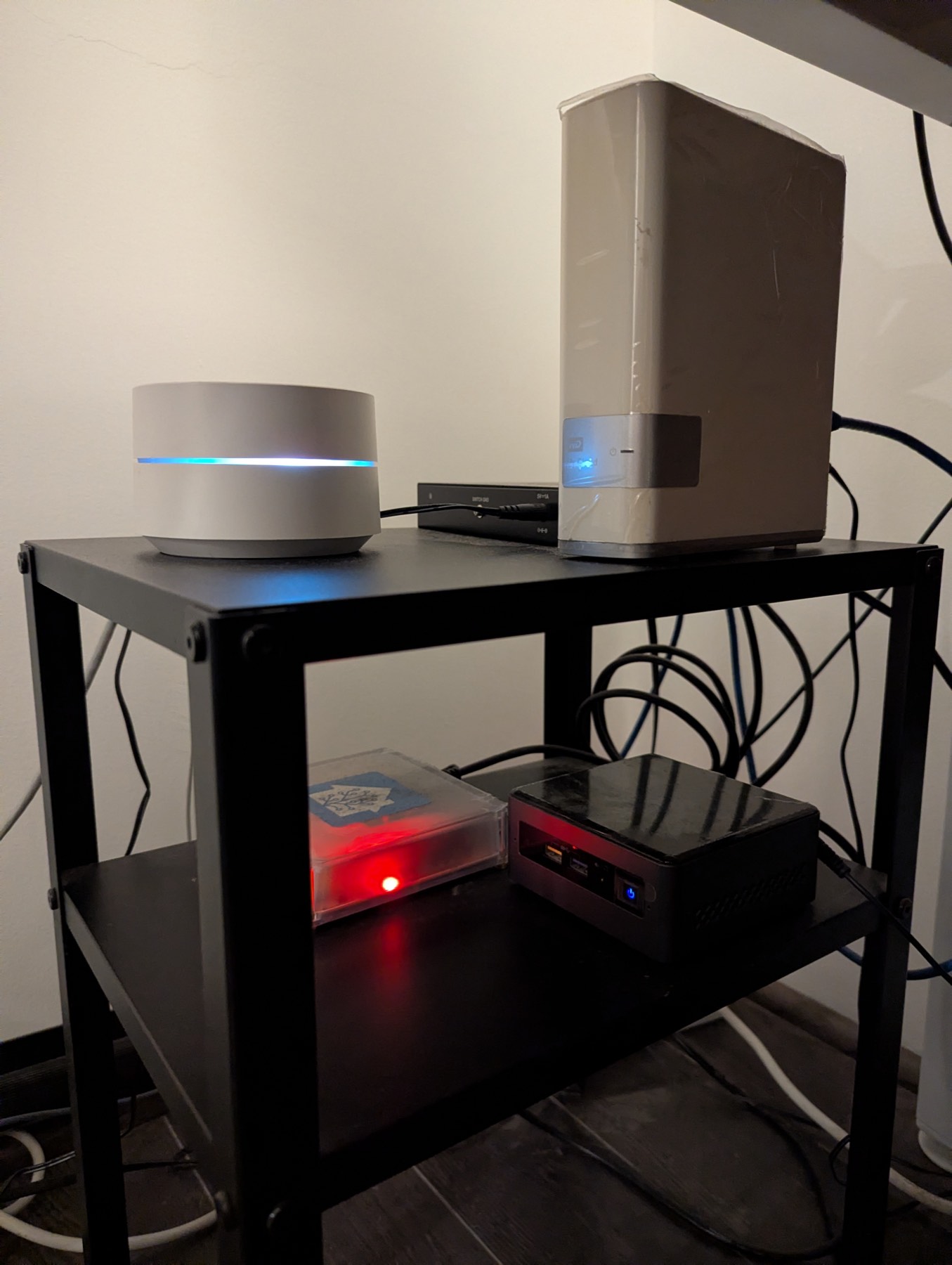 The home lab rack - mesh WiFi, a network drive, a Home Assistant Yellow and the NUC server