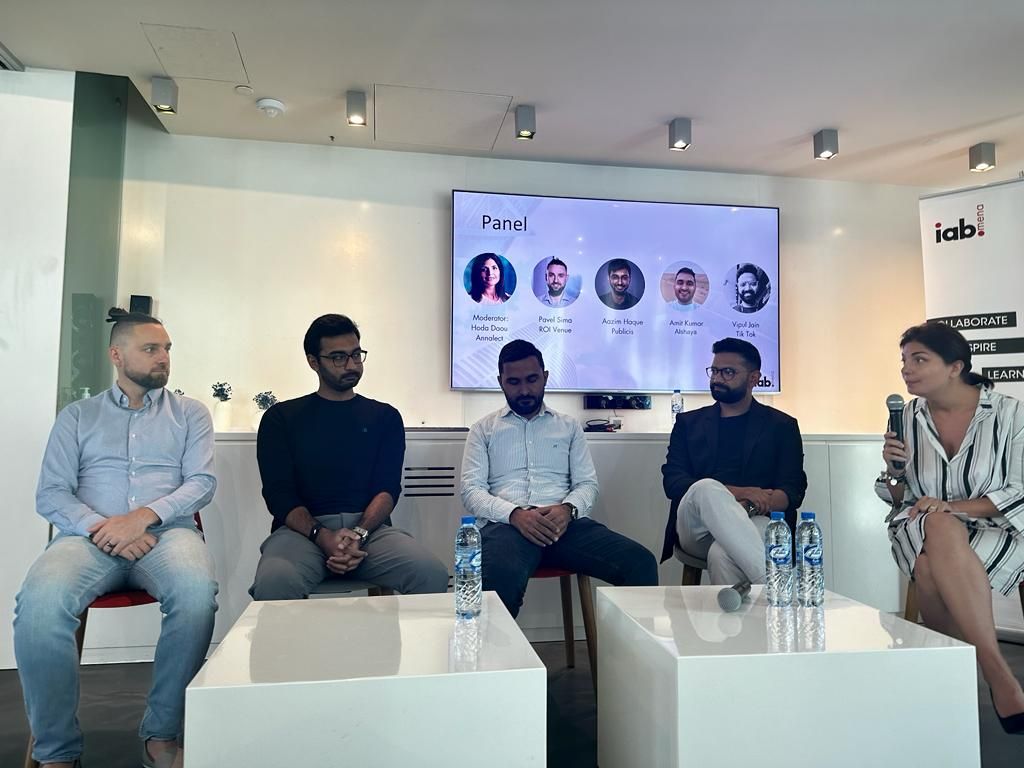 Aazim on the IAB MENA attribution panel in Dubai, panelists seated in front of a screen listing the speakers